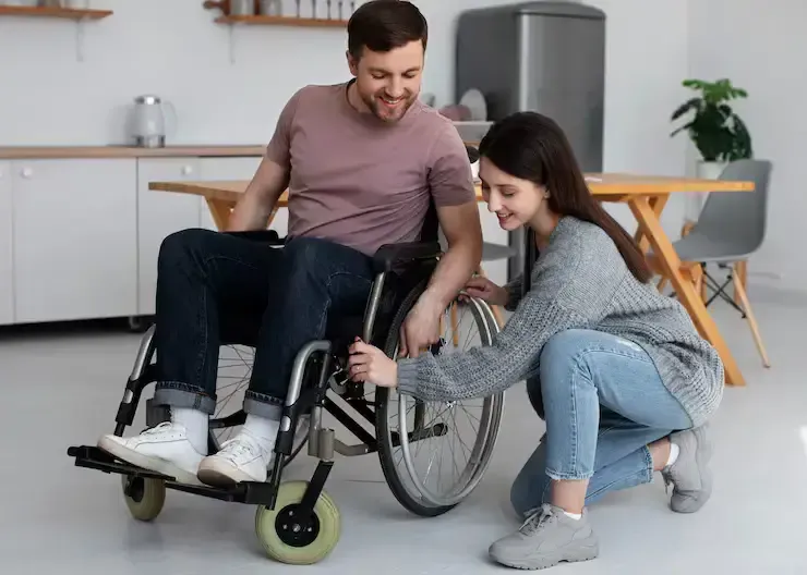 Support worker sharing a warm, reassuring moment with an NDIS participant during a respite care session in Cannington, Western Australia